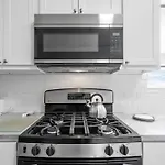 Newly Rehabbed Greystone With 2 Private Apartments, Backyard, Garage, Laundry, Close To Expressway