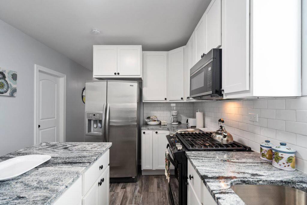 Newly Rehabbed Greystone With 2 Private Apartments, Backyard, Garage, Laundry, Close To Expressway *